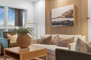 a living room with a couch and a table at RC403A- The Landing Lookout condo in Branson