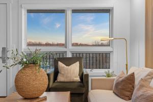 a living room with a couch and a chair and a window at RC403A- The Landing Lookout condo in Branson
