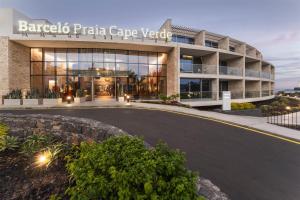 a building with a parking lot in front of it at Barceló Praia Cape Verde in Praia