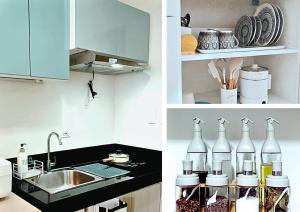 a kitchen with a sink and a counter with bottles at The Lumière Stays Cozy Mallside Boutique Haven in Trece Martires