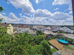 a view of a city with houses and a blue sky at Vous êtes bienvenue in Ramstein-Miesenbach