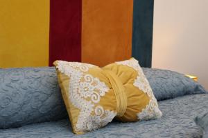 a bed with two pillows on top of it at Maison Gadì in Maiori +23 photos