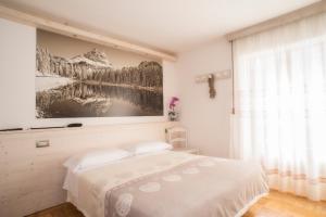 Postel nebo postele na pokoji v ubytování Albergo Meublè Victoria