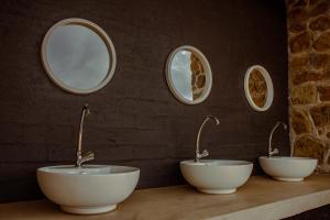 three white bowls on a counter with three mirrors at Karoo 62 Escape - A-frame in Ladismith