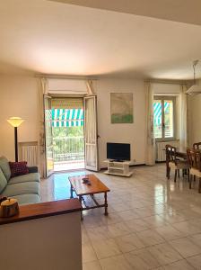 a living room with a couch and a table at Miramare Apartment in Ancona
