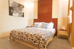 a bedroom with a large bed with a wooden headboard at Maresia in Gili Islands +68 photos