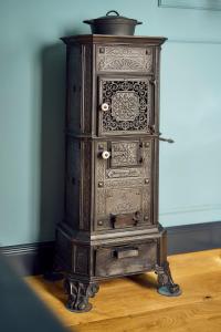 an old wooden cabinet sitting on top of a table at Hotel Lahneck in Nievern