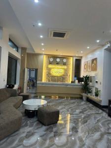 a lobby with a couch and a table in a building at Khách Sạn Ka Long in Móng Cái