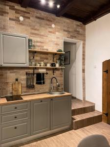 a kitchen with a sink and a counter at East Mountain Villa - Private Nature Retreat in Baranja in Batina
