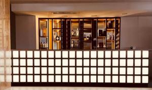 a bar in a building with a lot of windows at Canyon Hills Hotel in Yerevan