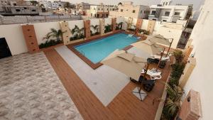 an overhead view of a swimming pool on a building at Hôtel Mandela Nouakchott in Nouakchott