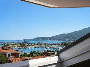 a view of a harbor from a balcony at Casa Olgaluna - Art Home in La Spezia
