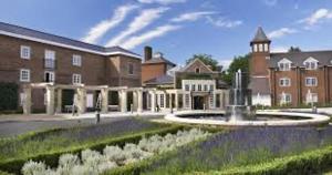 a large building with a fountain in front of it at 1 Bed Apartment Sleeps 2 -Free Parking -WiFi & Tv in Sutton Coldfield