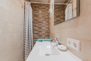 a bathroom with a white sink and a mirror at Holiday Home Marina 9 in Portals Nous +18 photos
