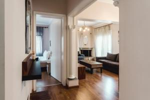 a living room with a couch and a table at Angelikis Maisonette in Kastoria