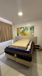 a bedroom with two mattresses sitting on a bed at CRCN - Evian Thermas Residence in Caldas Novas +147 photos