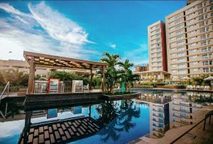 a resort with a swimming pool and a building at CRCN - Evian Thermas Residence in Caldas Novas