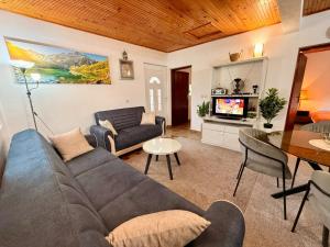a living room with a couch and a table at The Mountain's Embrace Villa in Gluhi Do