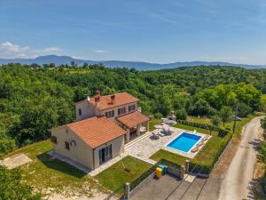 an aerial view of a house with a swimming pool at Villa Andretti in Gračišće