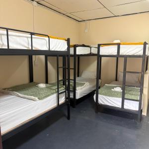 a room with three bunk beds in it at Hidden Valley Pai in Pai