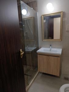 a bathroom with a sink and a shower and a mirror at Grand Center Boutique Hotel in Kyrenia +22 photos
