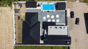 an overhead view of a building with a swimming pool at Villa Azure Sea in Bijeljina