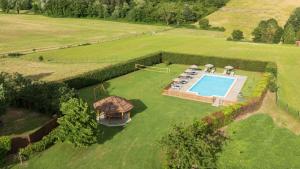 an aerial view of a yard with a swimming pool at La Pietraia by VacaVilla in Poppi