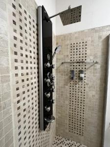a shower with a glass door in a bathroom at Pellegrino House in Palermo +40 photos