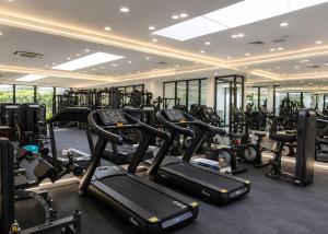 a gym with lots of treadmills and elliptical machines at Aqualina C3-4 by HolidayKeys in Kyrenia