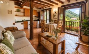 a living room with a couch and a table at APARTAMENTOS LA COTERA sc in Cambarco