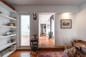 a living room with a hallway with a window at Between sea and Altafulla castle in Altafulla