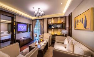 a living room with a couch and a table at Braira Al Olaya in Riyadh