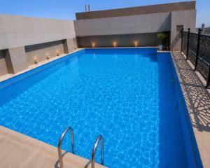a swimming pool on top of a building at Continent Al Marzam in Medina