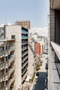 a view of a city street with tall buildings at Cozy Japandi 3LDK in Namba for Groups in Osaka