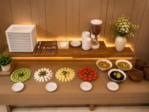 a table with plates of food on it at OTEL MOLA BALIKESiR in Balıkesir +6 photos