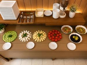 a table with plates and bowls of food on it at OTEL MOLA BALIKESiR in Balıkesir