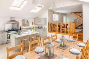 a kitchen and dining room with a table and chairs at Laylands in Wells next the Sea