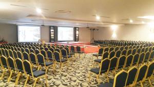 an empty room with chairs and a stage in it at LRS Hotels Port River Hotel & Spa - Ultra All Inclusive in Side +55 photos