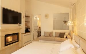 a living room with a couch and a fireplace at Masseria Bandino & Spa in Otranto