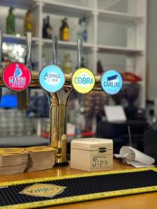 a group of signs on a counter in a store at Travel Plaza Hotel in Desborough