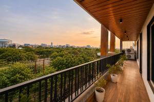 a balcony with a view of the city at Mazestic Bay Hotel & Banquet in Noida