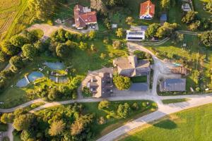 an overhead view of a house with a yard at Vitalhof am Kreischberg by ALPS RESORTS in Bodendorf