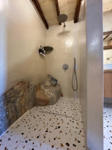 a bathroom with a shower with a shower at NeSi Cycladic Living in Ano Syros