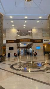 a large building with a lobby with a large floor at Saif Al Majd Hotel in Mecca