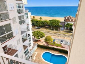 a view of the beach from the balcony of a apartment at Mediterranean Escape - Sea Views Pool in Malgrat de Mar