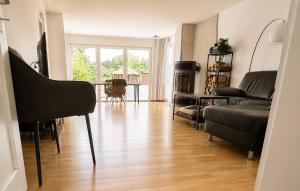 a living room with a couch and a table at Rebenlaub in Heringen