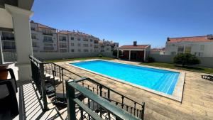 a swimming pool on the balcony of a apartment at RIVABeach House in Lourinhã