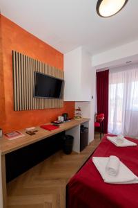 a hotel room with a bed and a desk at Sto Rija in Krk