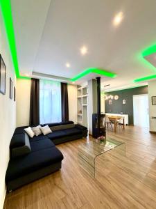 a living room with green lights on the ceilings at Casa Gemelli in San Fedele Intelvi