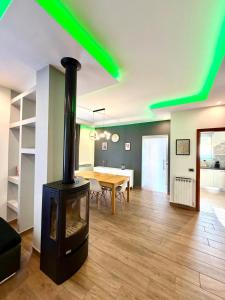 a living room with a wood stove in it at Casa Gemelli in San Fedele Intelvi